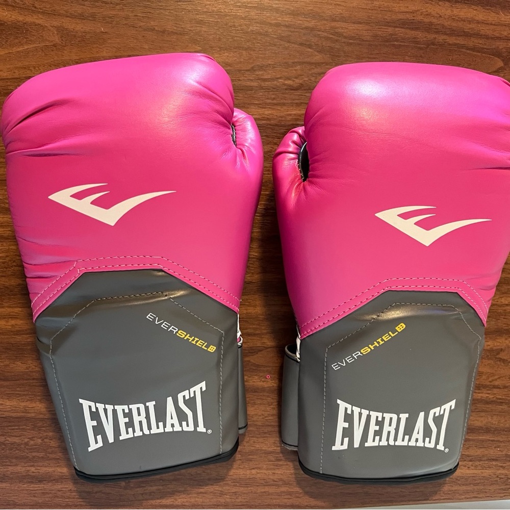 Everlast Boxing Gloves, 12 Oz. & a pair of brand new Sanabul black hand wraps.